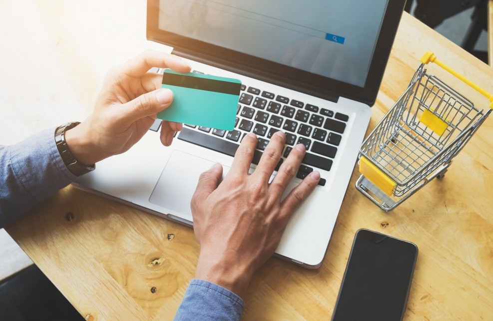 Unleashing Global Potential: The Imperative of Professional Retail Translation Services a person making a purachase online using a credit card