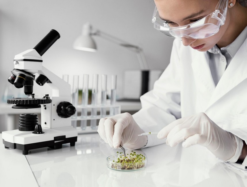 Biotechnology Translation Services researcher examining a sample under a microscope