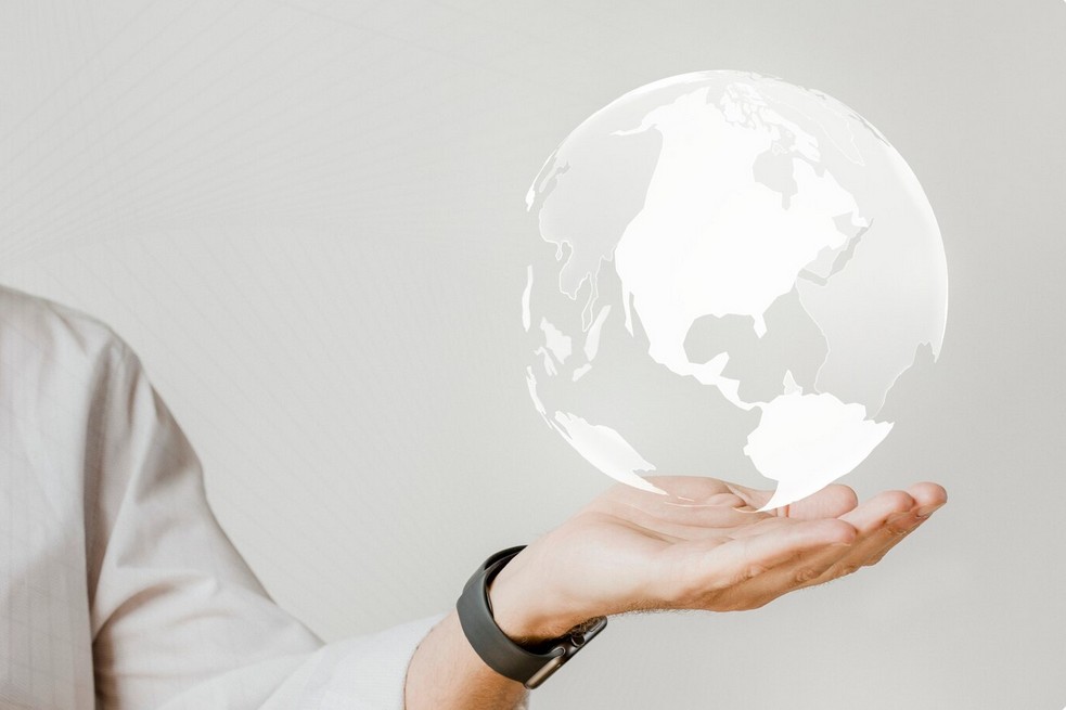 Unleashing Global Potential: The Imperative of Professional Retail Translation Services man holding a glob on his hand