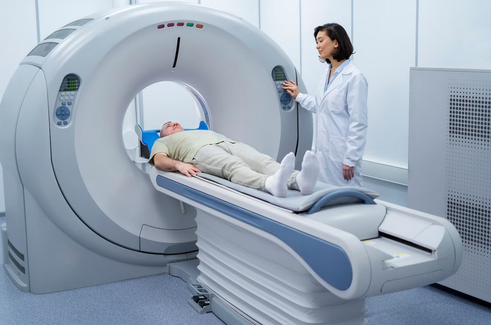 Medical Device Translation Services a doctor is helping a patient enter the MRI scanner.