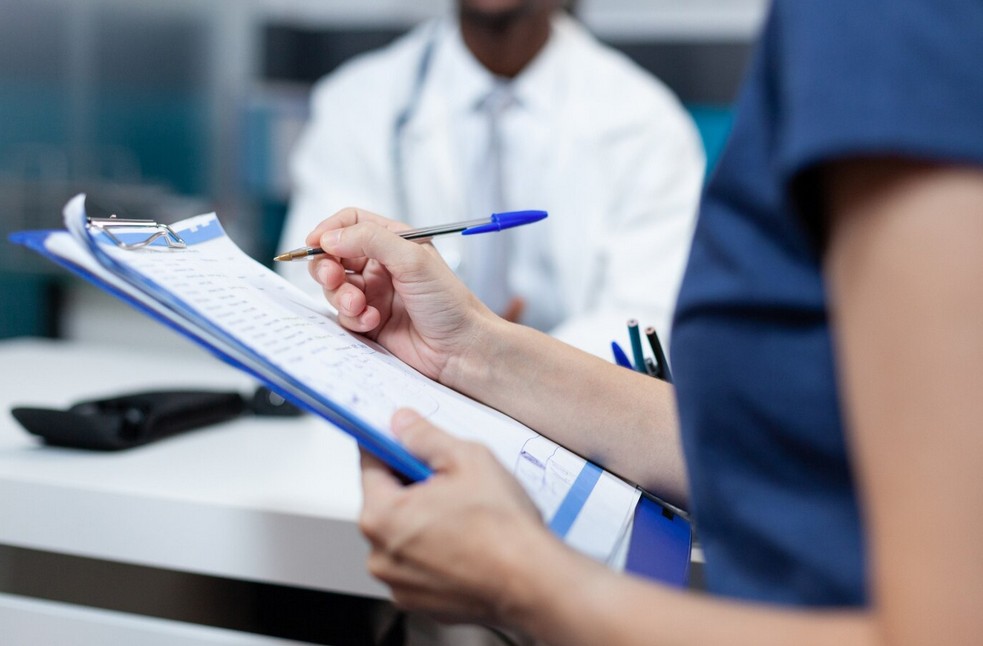 a doctor updating a patient information