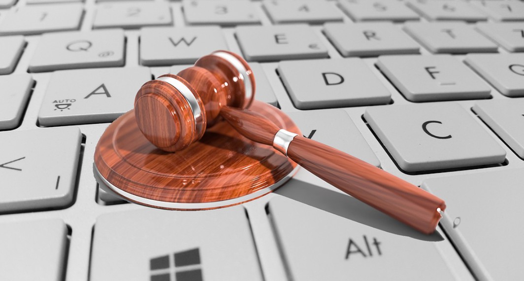 The Ultimate Guide to Mastering Global Legal Translation Services. an image showing a judge gavel on a laptop
