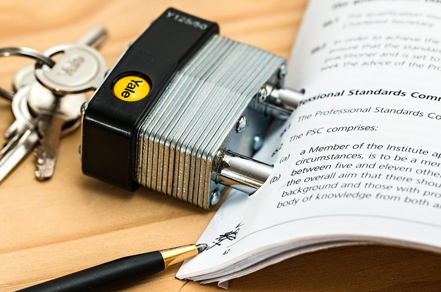 The Ultimate Guide to Mastering Global Legal Translation Services. Image showing a lock in a deck of cards