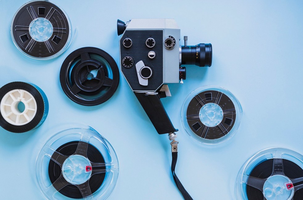 AI-Powered Localization: The New Frontier of Multimedia Translation. cinema camera with and film reels