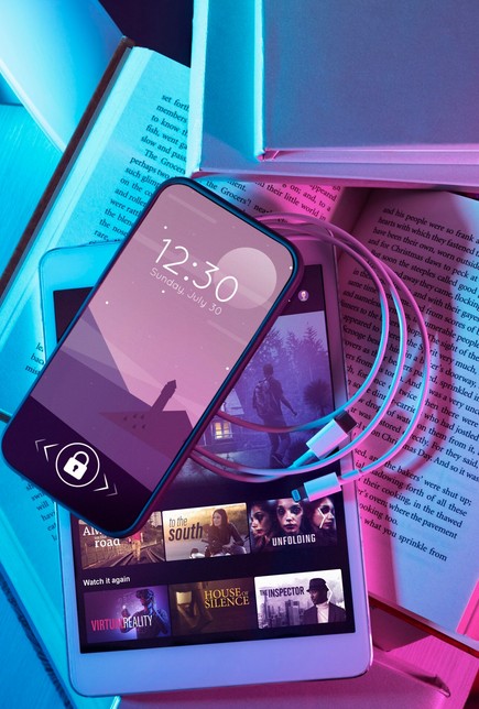 AI-Powered Localization: The New Frontier of Multimedia Translation. image showing a smattpgone on a book