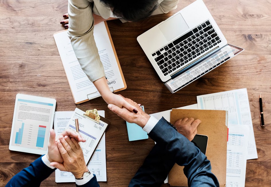 The Ultimate Guide to Mastering Global Legal Translation Services. partenres shaking hands
