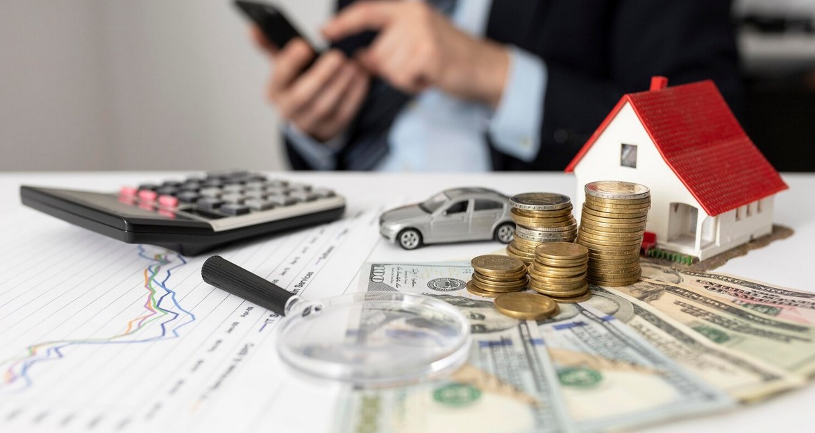 Transcreation vs. Translation: The Ultimate Guide for Fintech Marketing. man calculating with house model, coins, banknotes, calculator on the trable