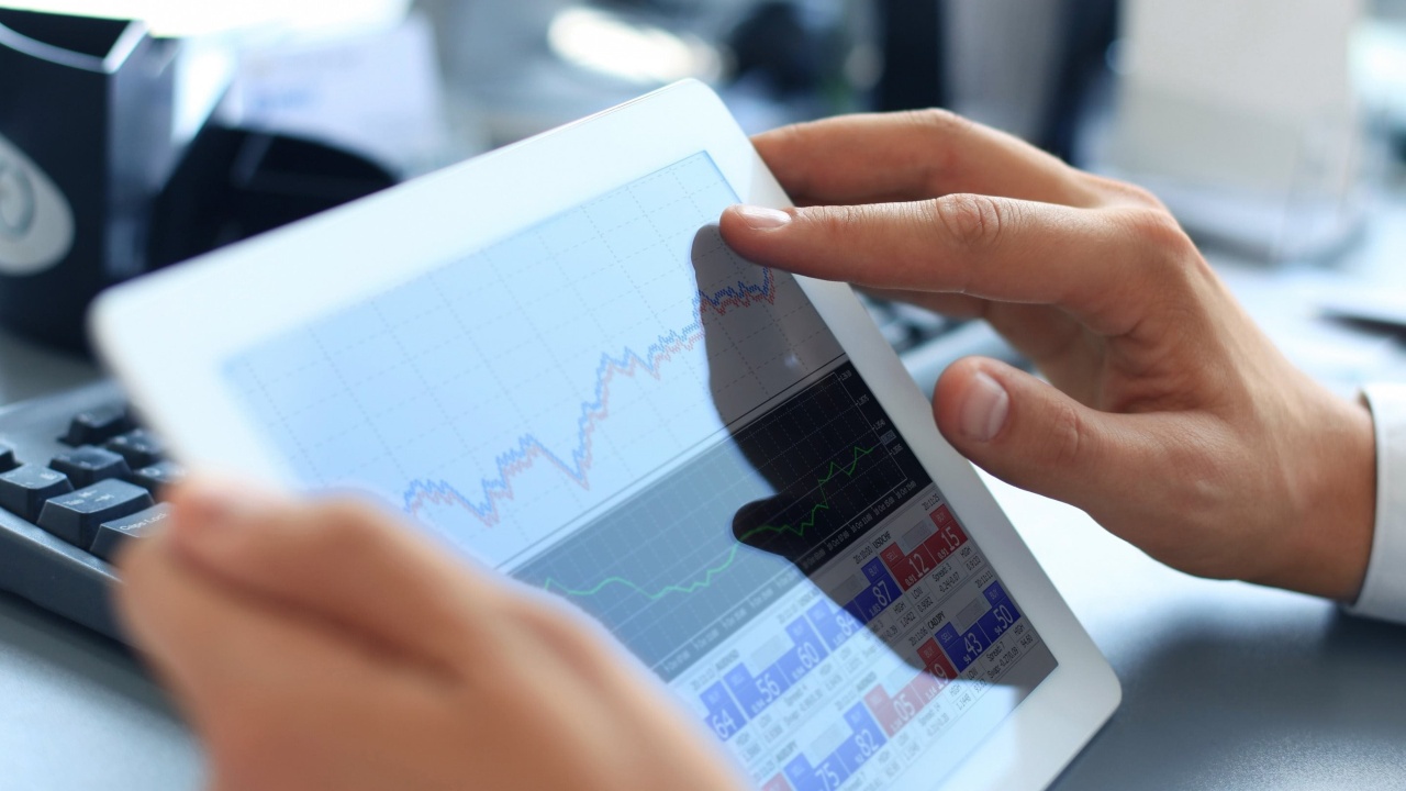 The Ultimate Guide to Launching a Multilingual Banking Website. a man working on a tablet