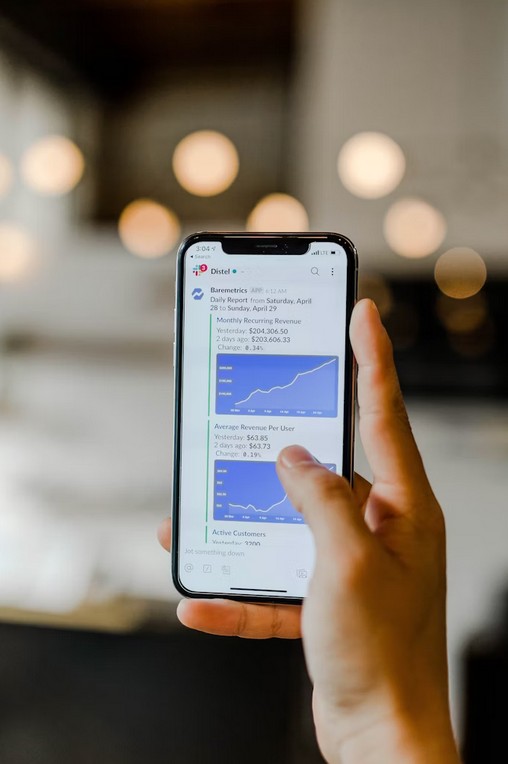 The Ultimate Guide to Launching a Multilingual Banking Website. a man holding a smartphone