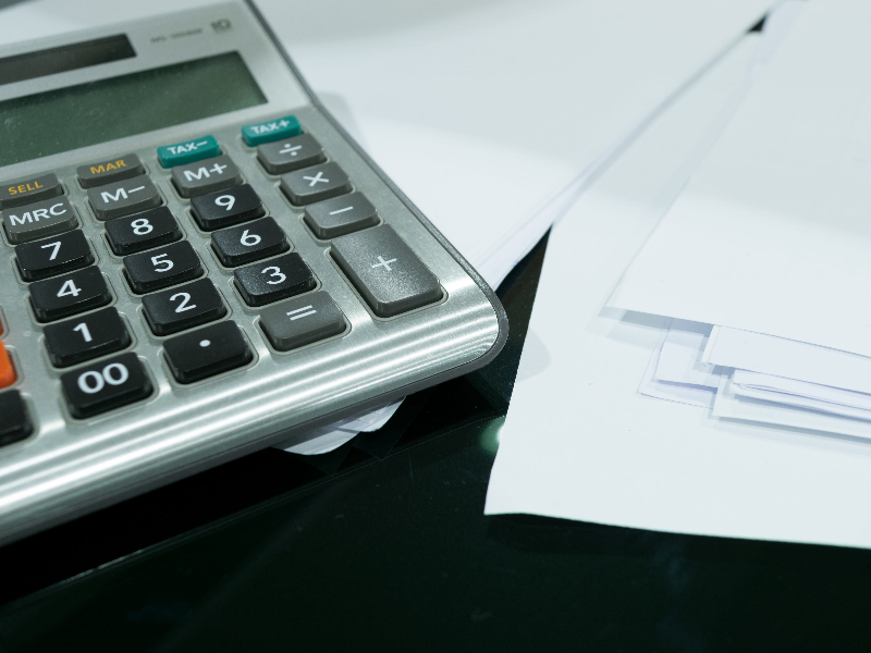 Transcreation vs. Translation: The Ultimate Guide for Fintech Marketing. calculator and financial sheets