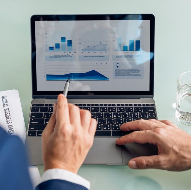 Catastrophe Averted: The Ultimate Guide to Financial Regulation Translation Compliance. laptop whowing financial stadistics