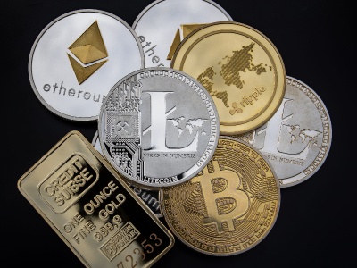 One Wrong Word: The Peril of Amateur Crypto Translation. several digital coins and a gold bar