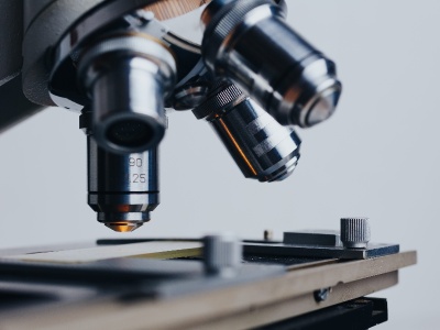 Eliminate Regulatory Risk: Secure Your Approval in the U.S., Europe, and Japan. an image showing a microscope