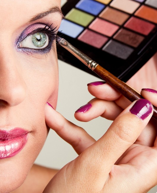 The Art of Translation: Unlocking New Markets for the Global Beauty Industry. a woman applying eye cosmetics