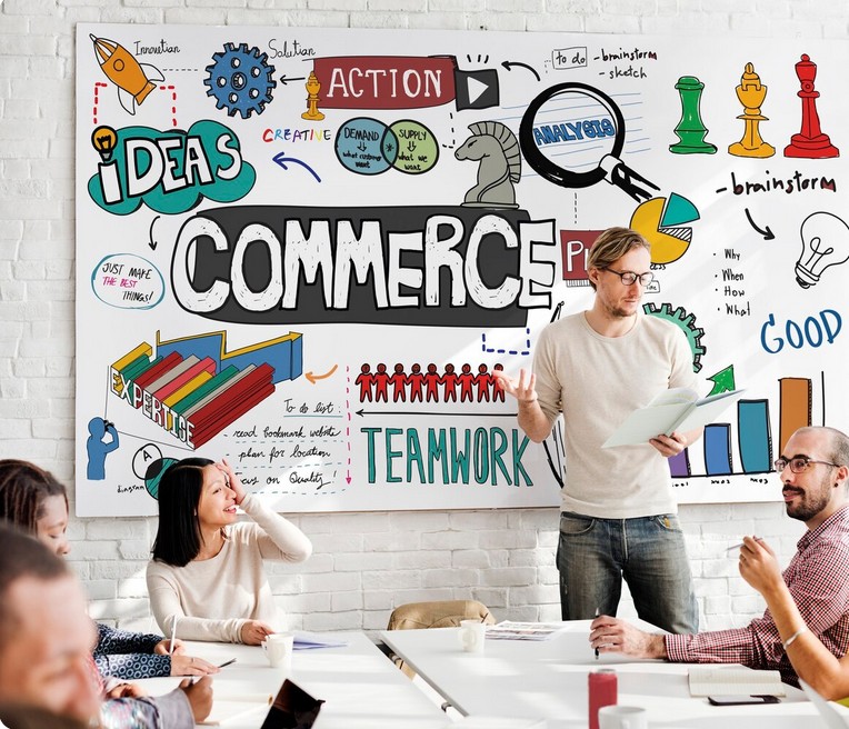 The Ultimate Guide to Winning New Markets with Retail Localization. employees at a meeting related to marketing digital campaign