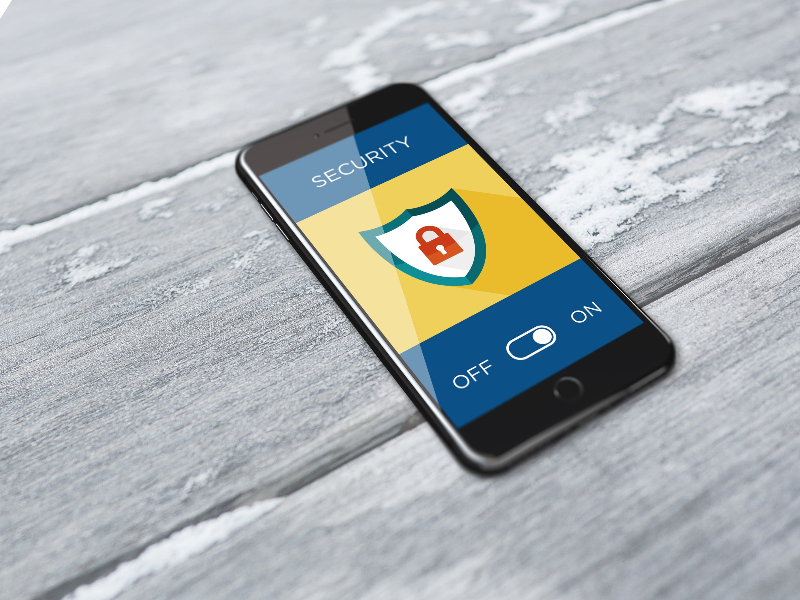 The Fintech & Blockchain Dictionary: What You Need to Know (And What They Won't Tell You). smarthphone displaying the security sign