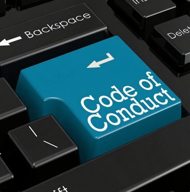 a keyboard with the word code of conduct