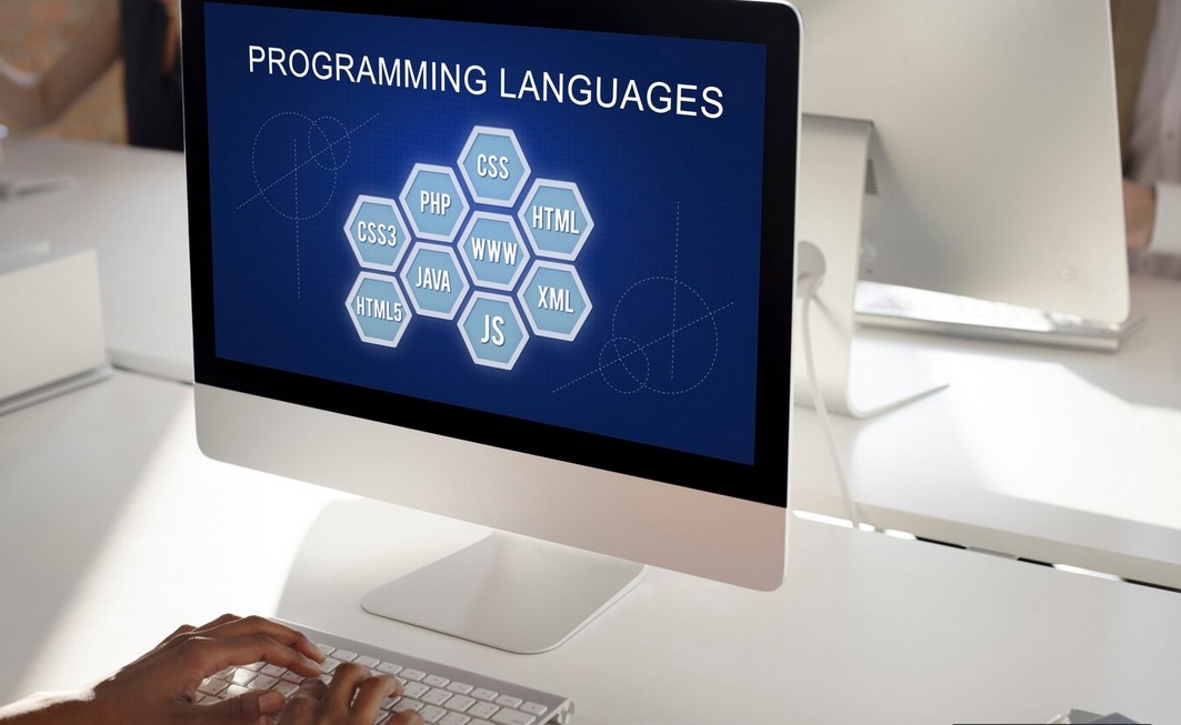 The Ultimate Strategic Guide to Conquering Global Markets: How to Choose a Retail Translation Services Partner. pc monintor showing the word language proramming