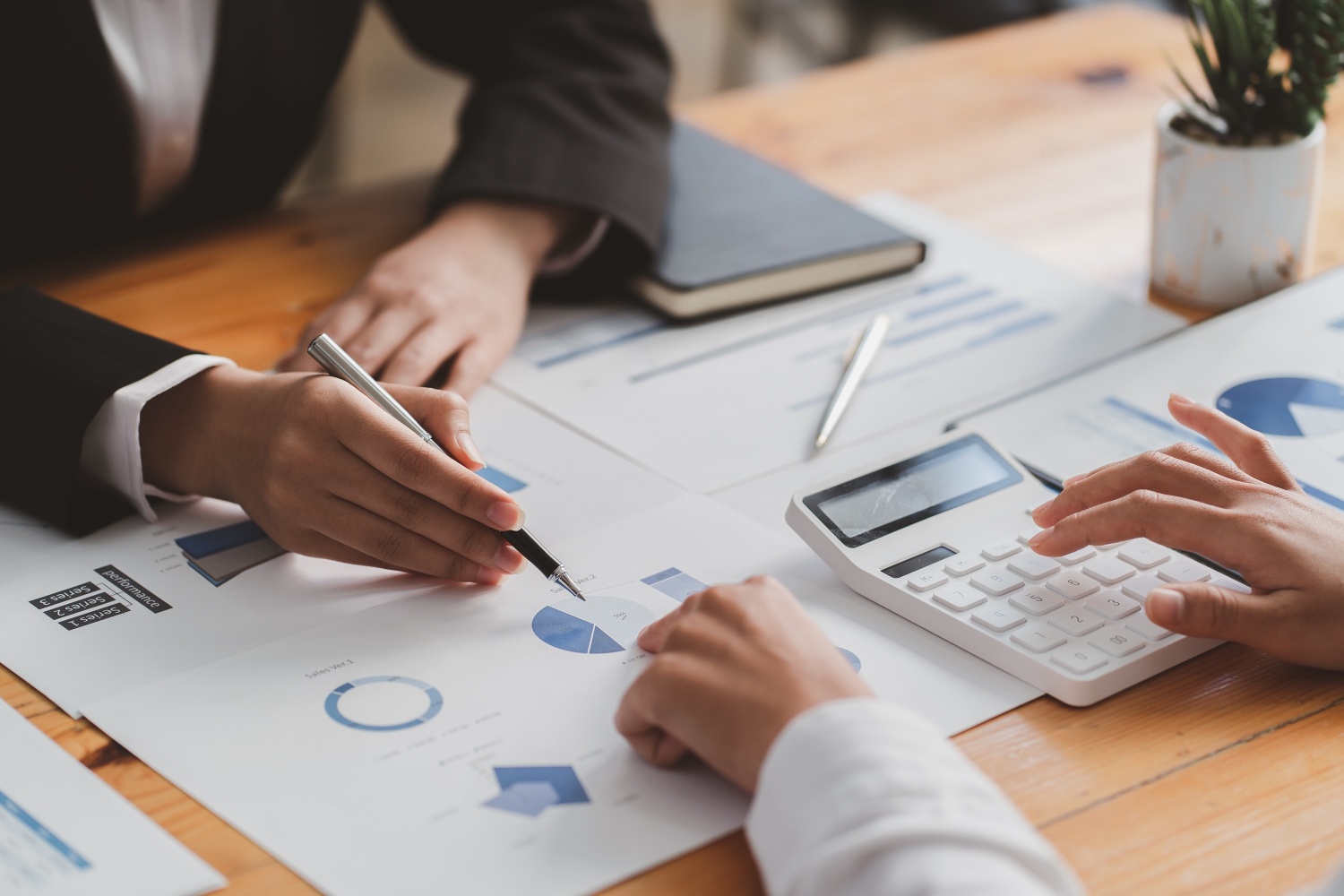 Beyond Translation: The Revolutionary Power of fintech marketing cultural adaptation. two employees discusiong a financial proyect