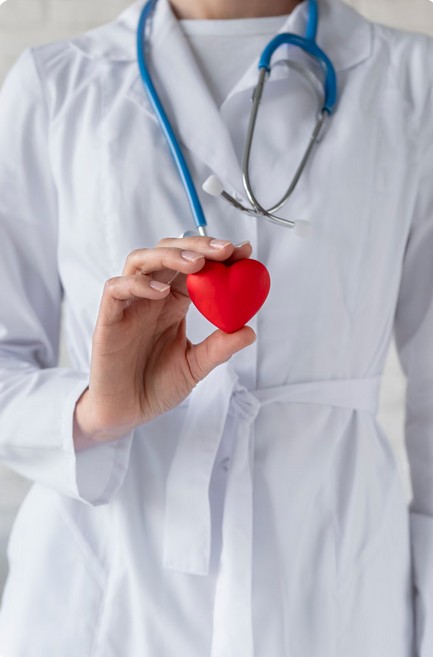 Guarantee First-Pass Regulatory Compliance Now. A doctor holding a stethoscope that shows a heart shape.