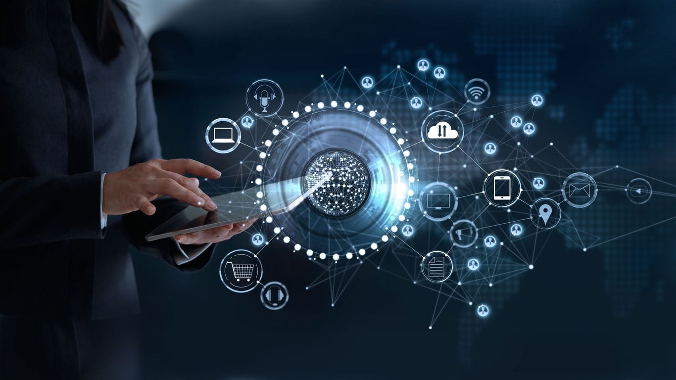 Guarantee First-Pass Regulatory Compliance Now. a person checking data on a tablet while data icons appears on a virtual screen