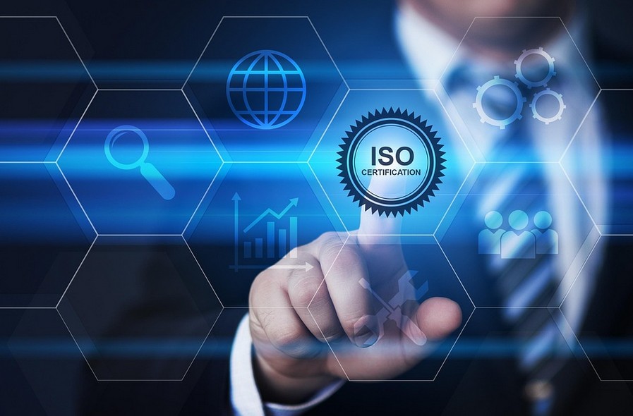 a person touching on a virtual screen the word iso with quality icons appearing there