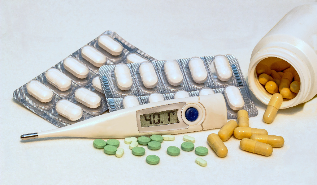 Eliminate Regulatory Risk: Secure Your Approval in the U.S., Europe, and Japan. iamge showing medical thermometer and medical pills