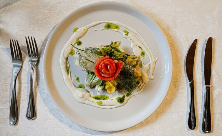 a plate and silverware on a table at a restaurant