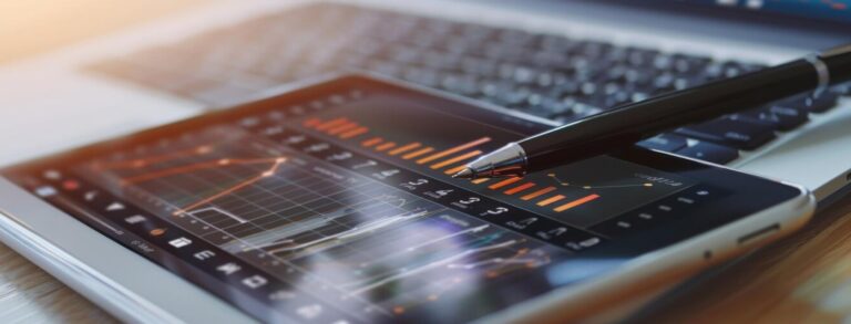 a pen on tablet displaying banking data