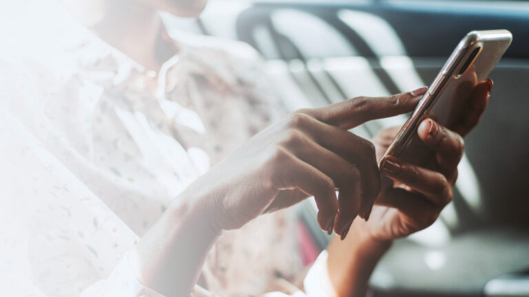 a woman cehcking a smartphone