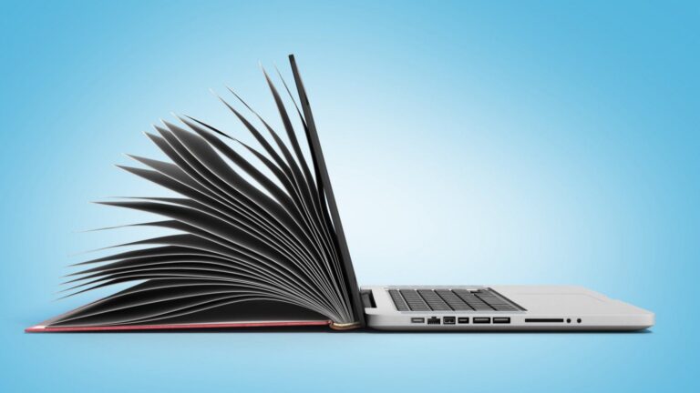 a conceptual image showing a book transformed into a laptop.